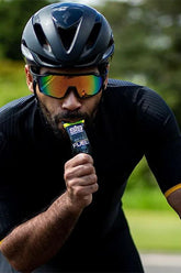 Cyclist consuming Science in Sport Beta Fuel Gel, enhancing endurance and cognitive performance during training.